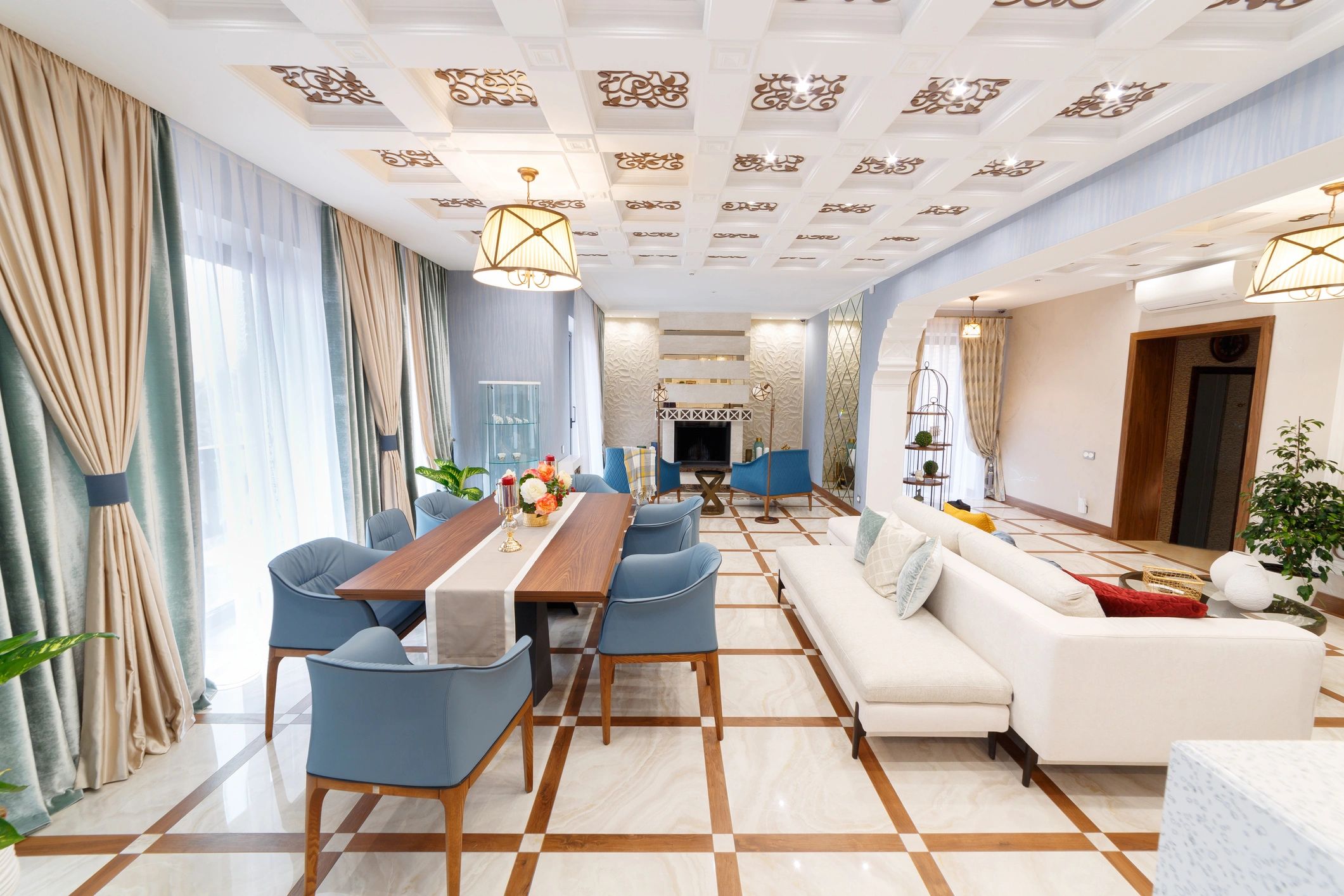 Estate interior with chandelier lighting and formal dining table