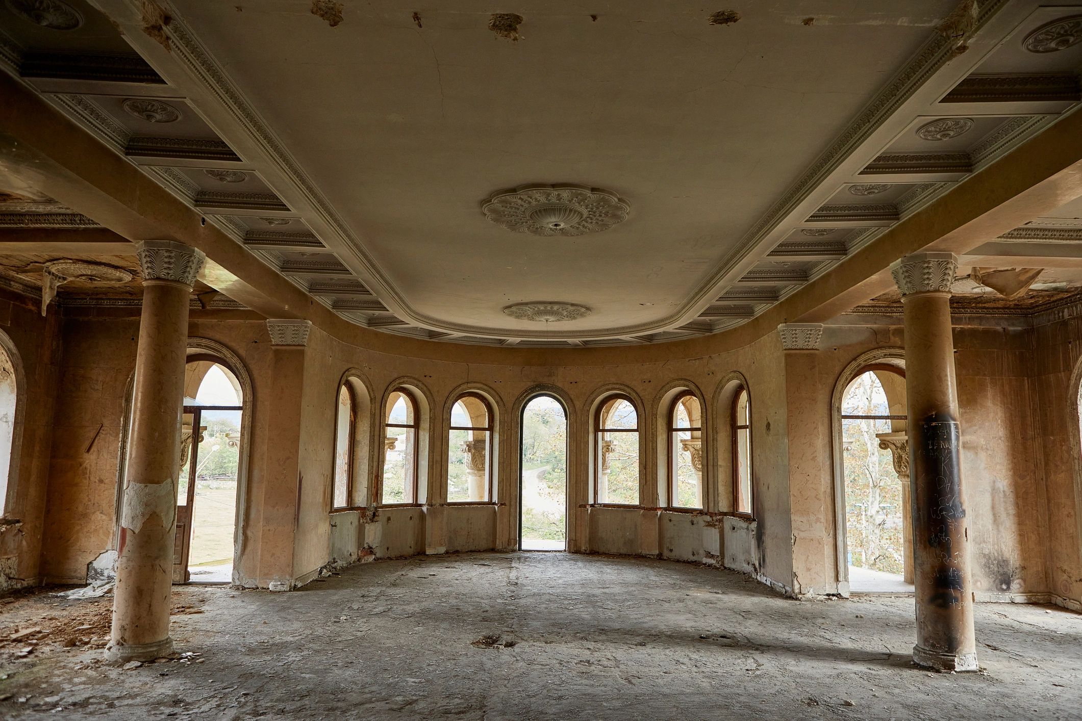 Architectural interior with staircase and tall windows
