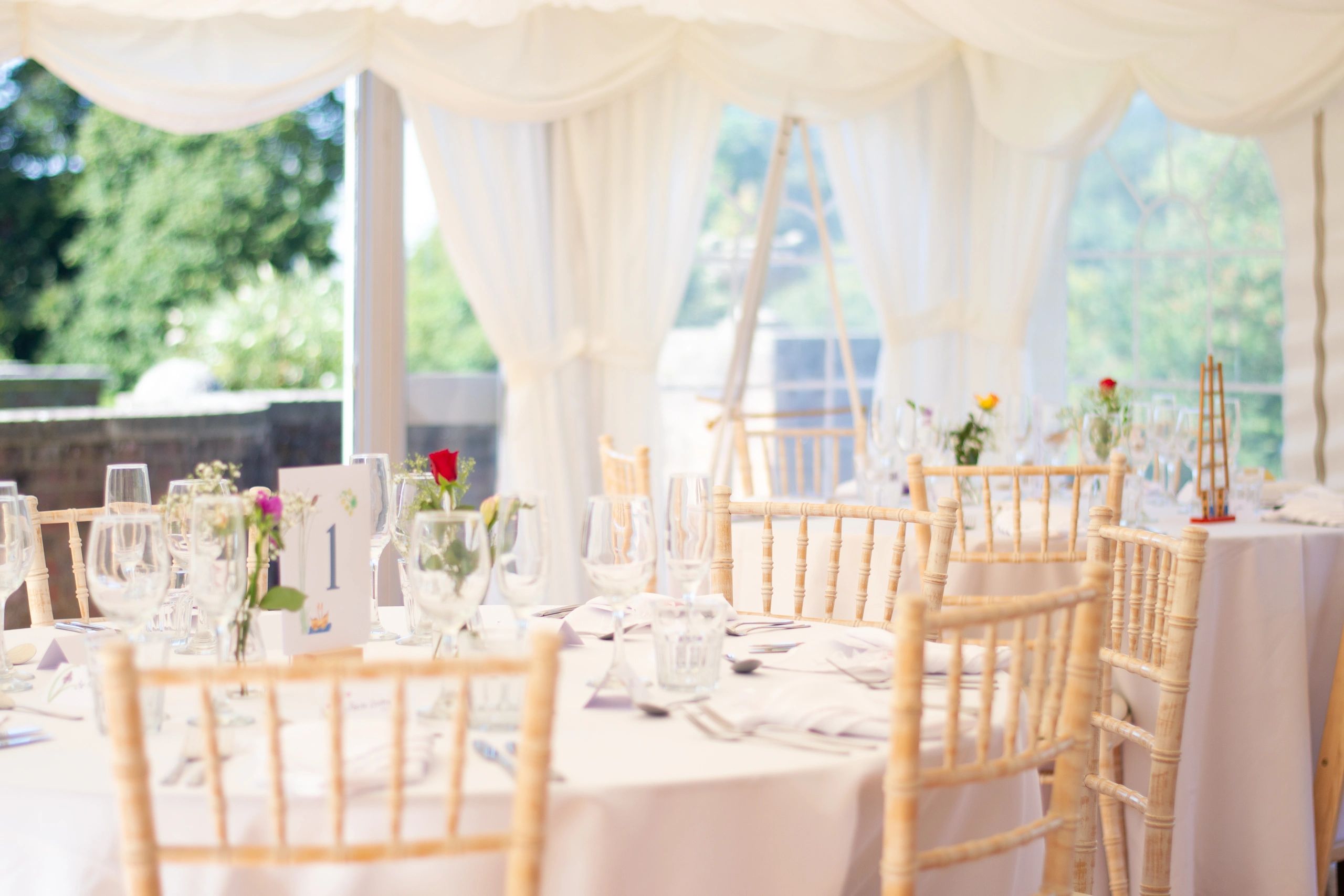 Reception table setup with glassware and elegant décor