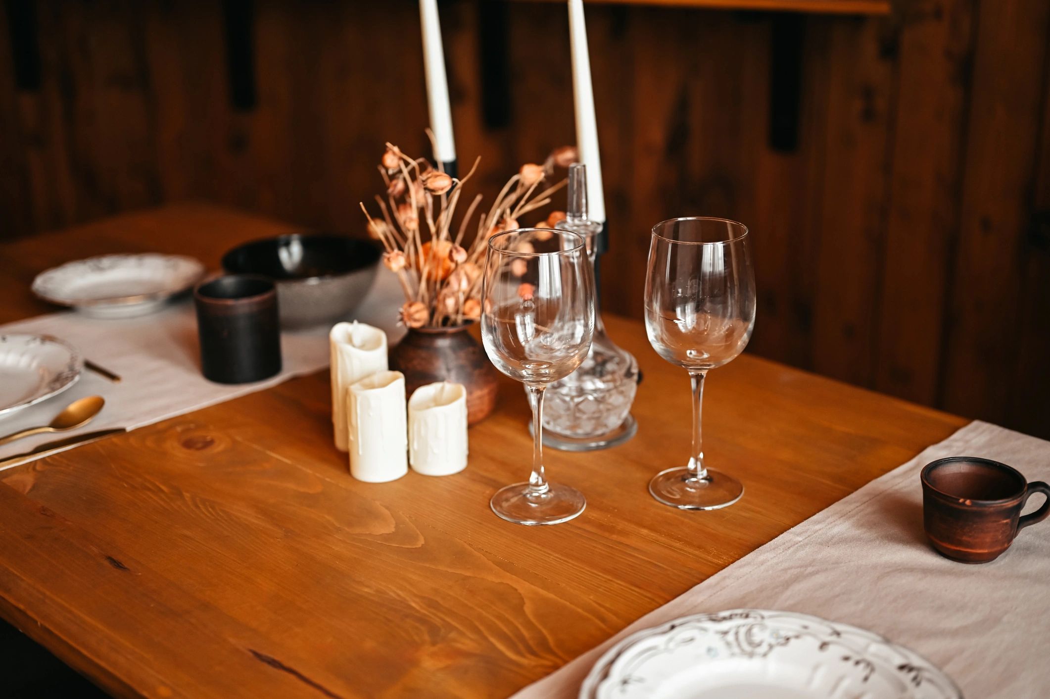 Rustic wooden table set for an elegant dinner party