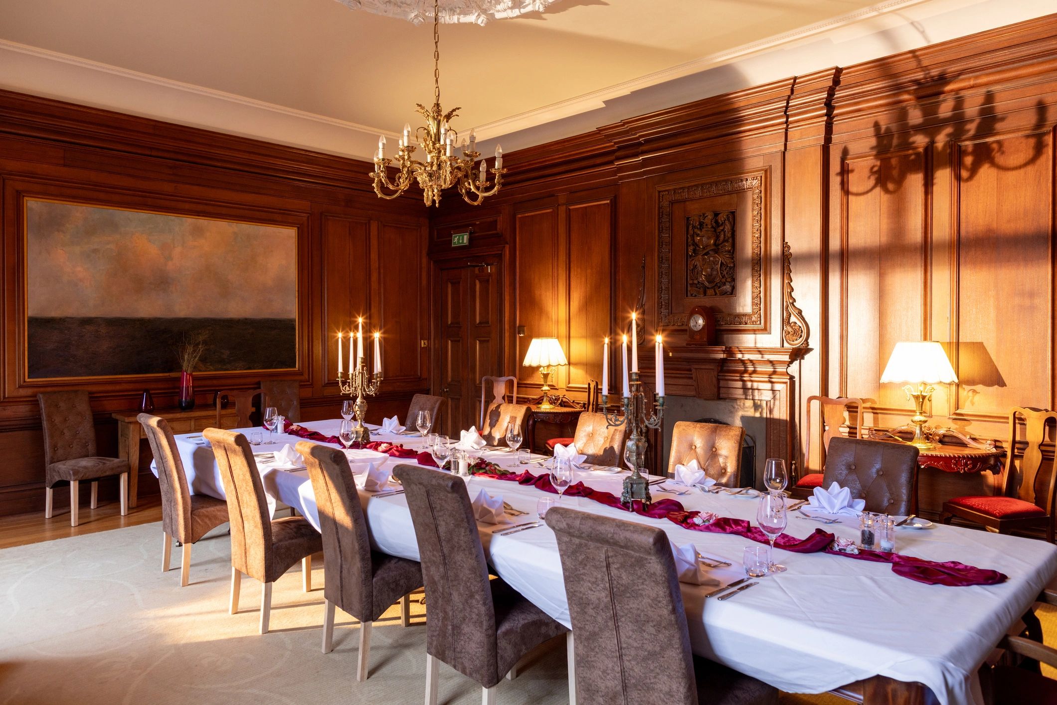 Candlelit luxury dining table setting with glassware and warm ambience